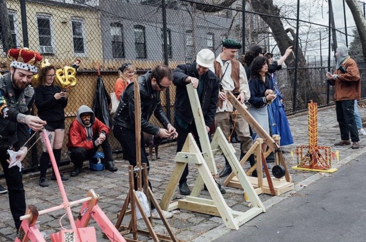 A row of homemade catapults at a park.