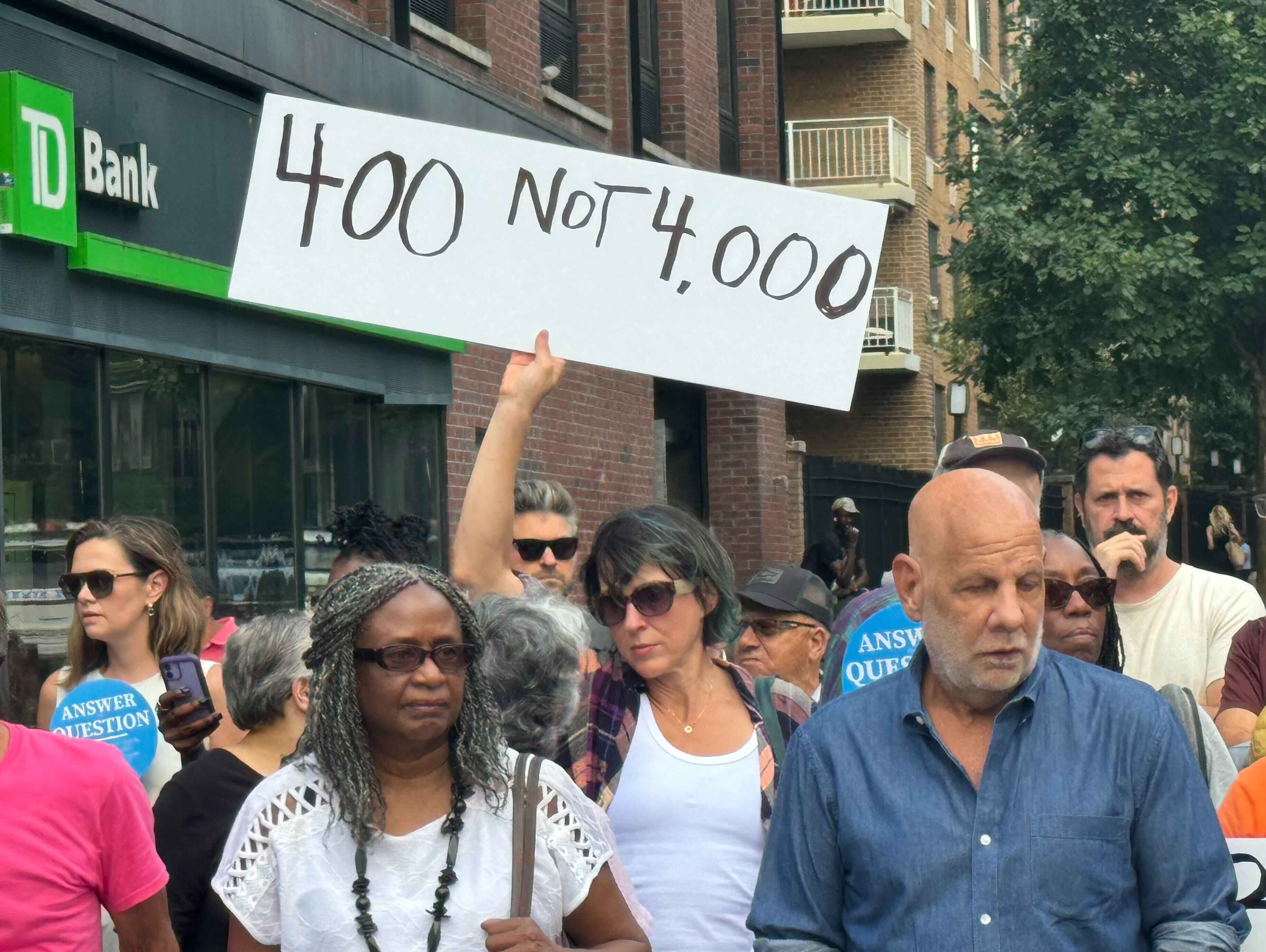 Clinton Hill neighbors mount protest Tuesday night against a complex of shelters for migrants in their neighborhood. The complex near the Brooklyn Navy Yard serves some 4,000 migrants, mostly asylum-seekers. The neighbors say that's too many for one location.
