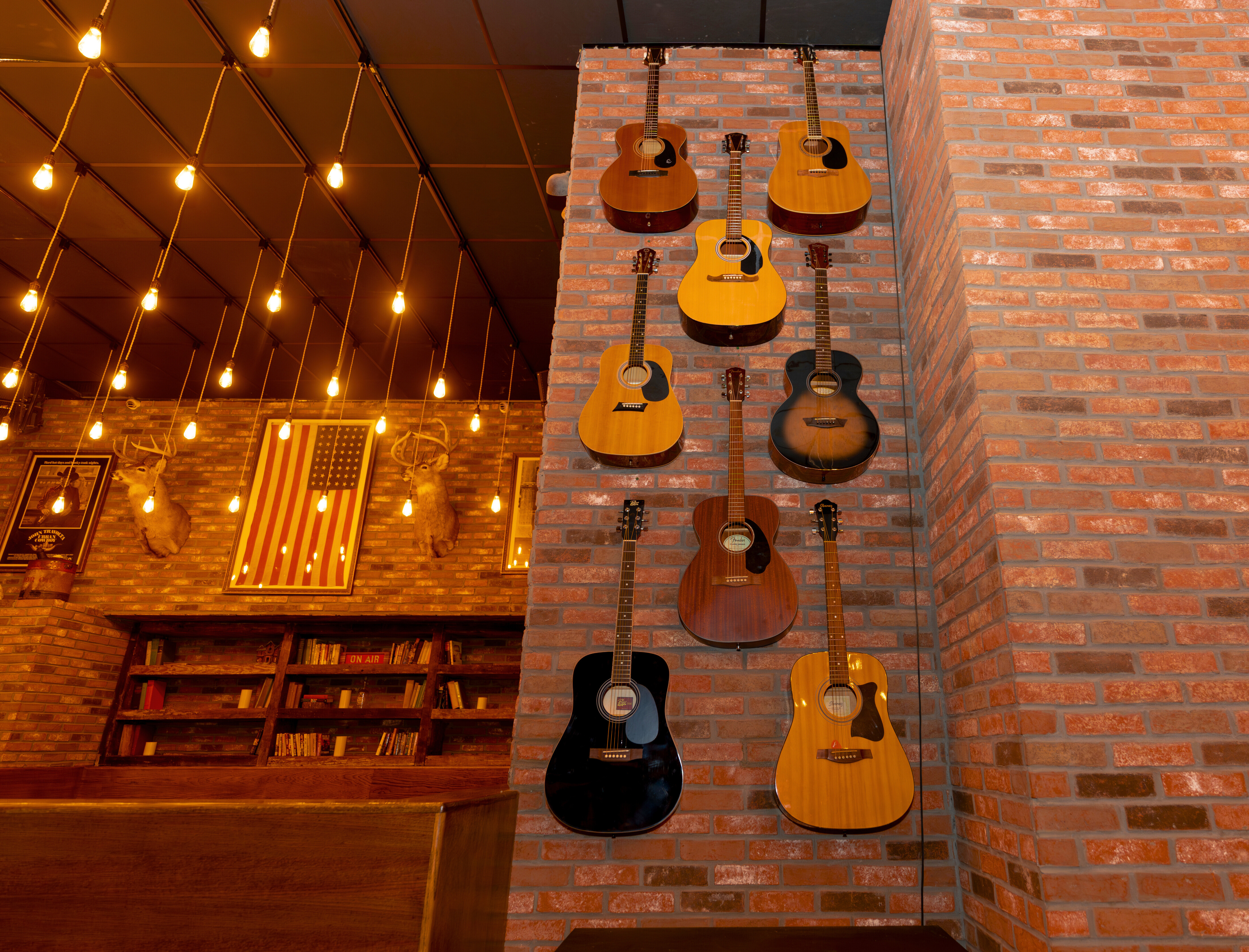 Guitars line a wall.
