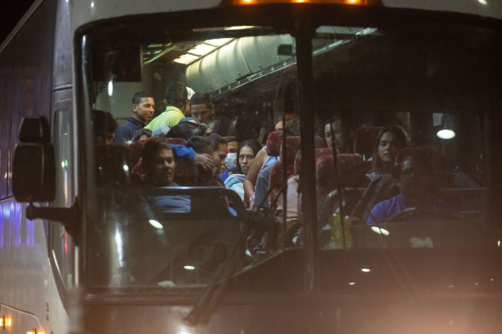Migrants arrive at the Port Authority bus terminal in New York City on Sept. 27, 2022.