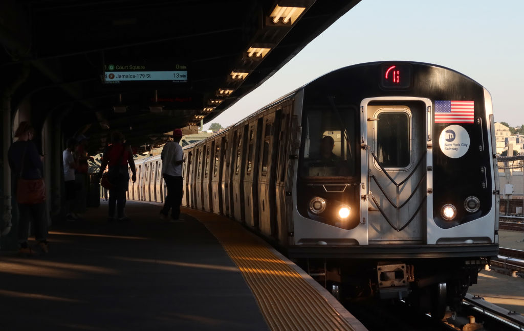 A G train arrives at the Smith-9th Streets subway station as people wait on the platform in Brooklyn on Aug. 3, 2022.