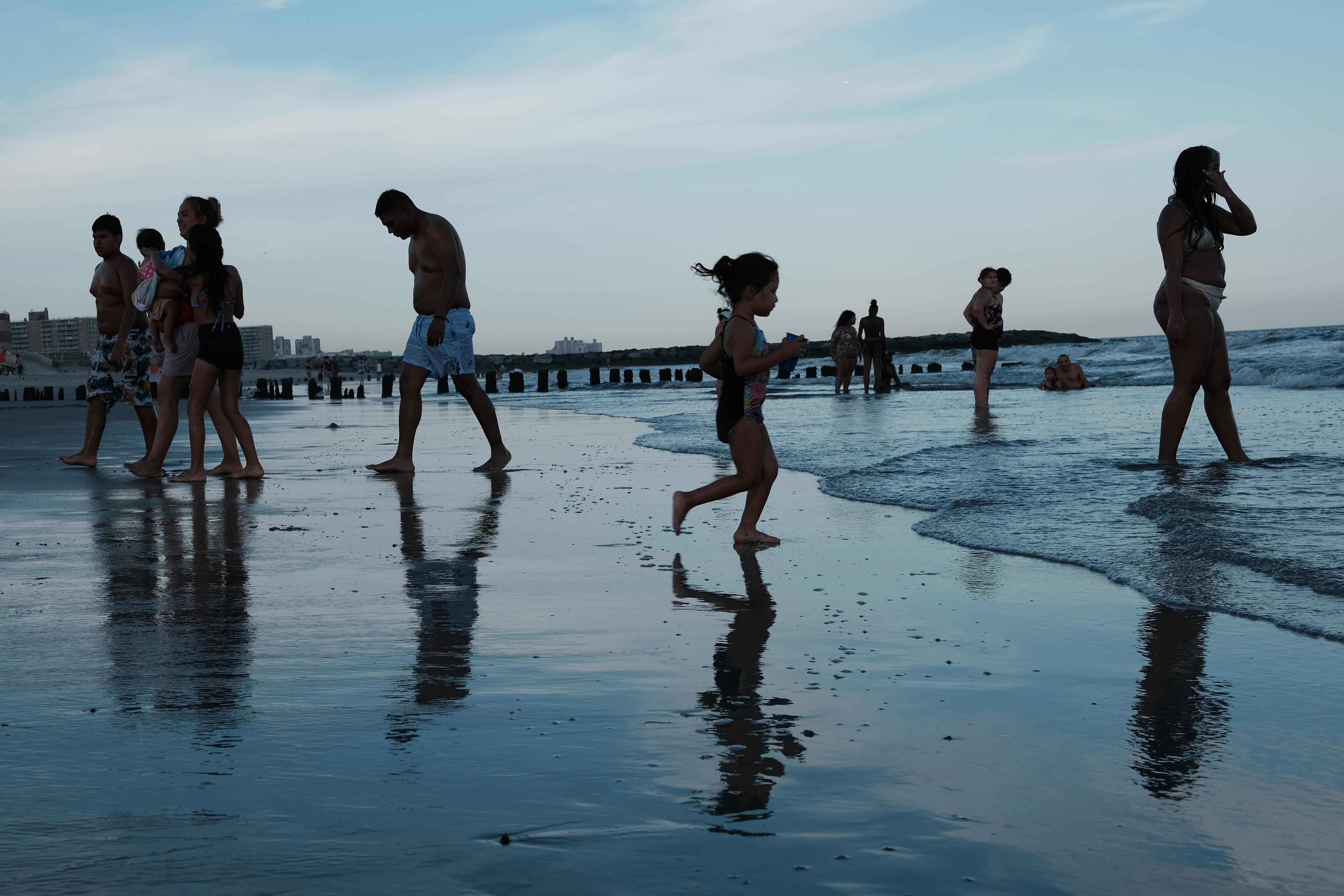 Several people on a beach.
