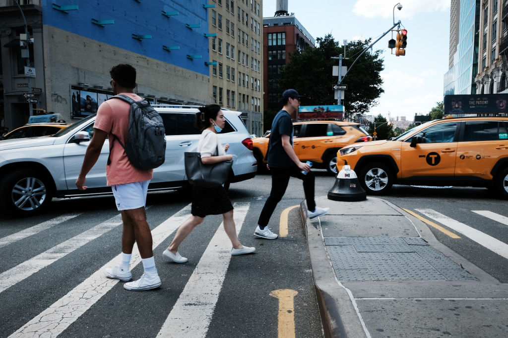 Pedestrians seen crossing the street in Lower Manhattan on Aug. 31, 2022.