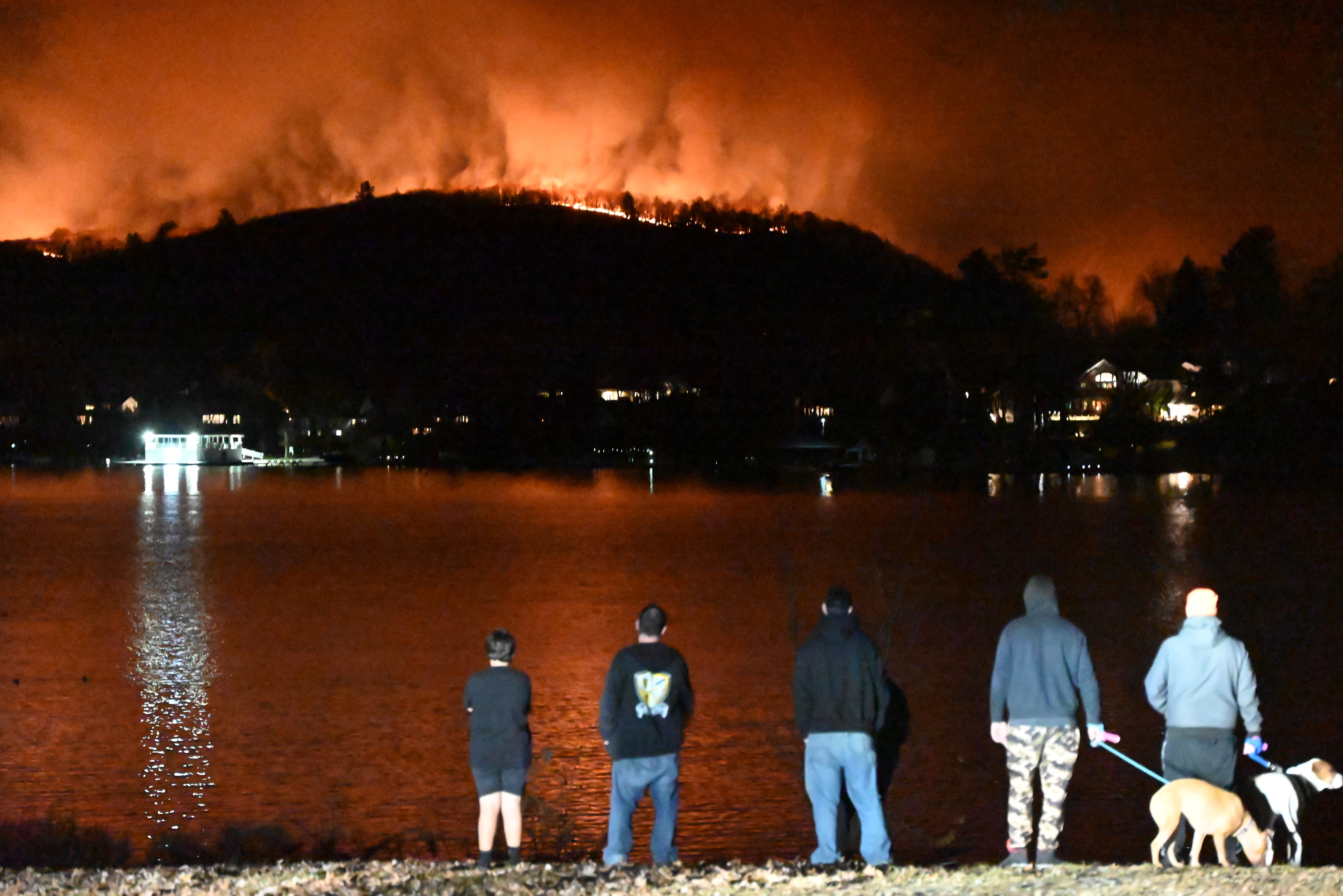 People watch a wildfire in West Milford, New Jersey, on Nov. 9, 2024.