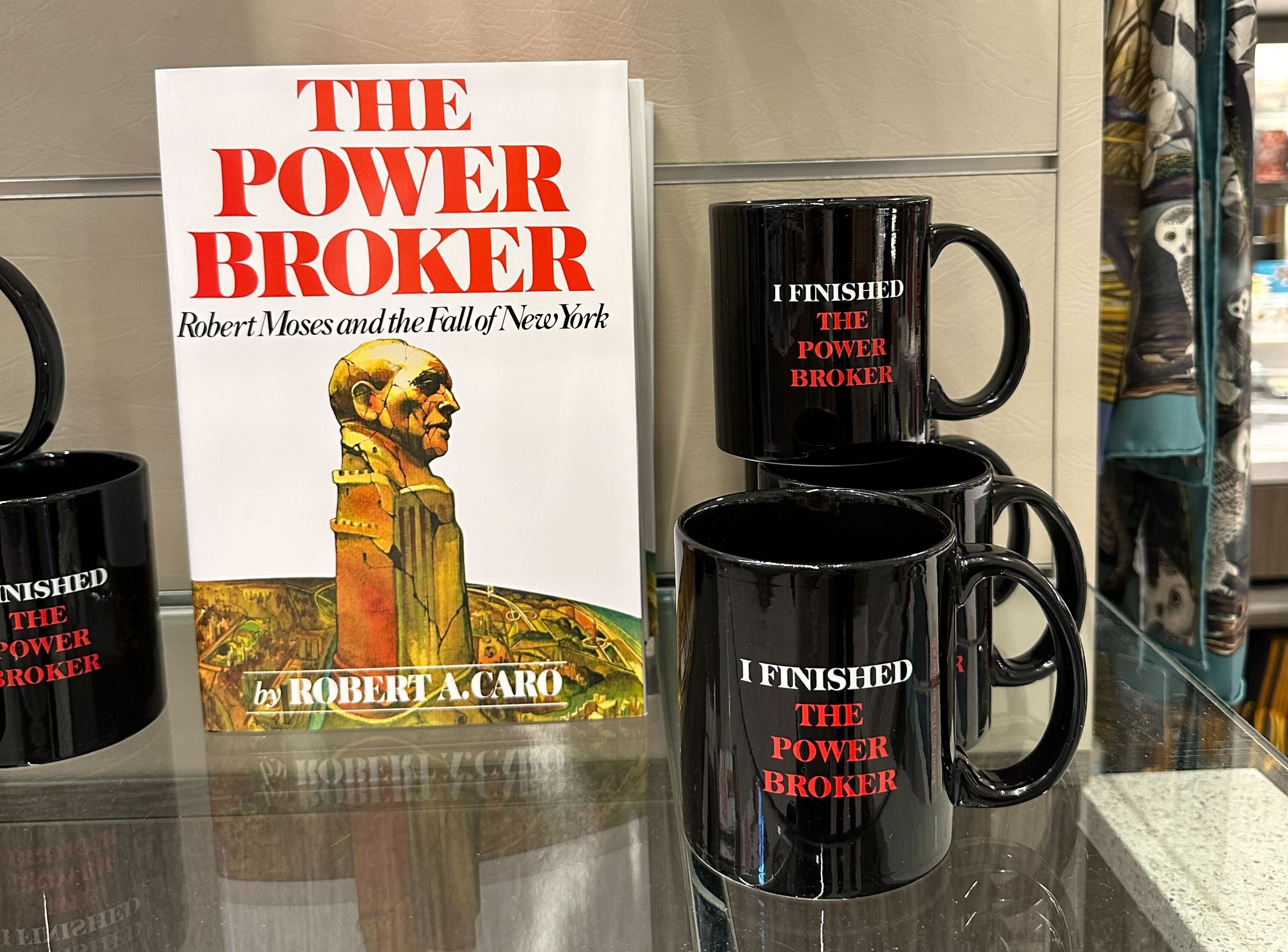 A mug that says "I Finished the Power Broker"