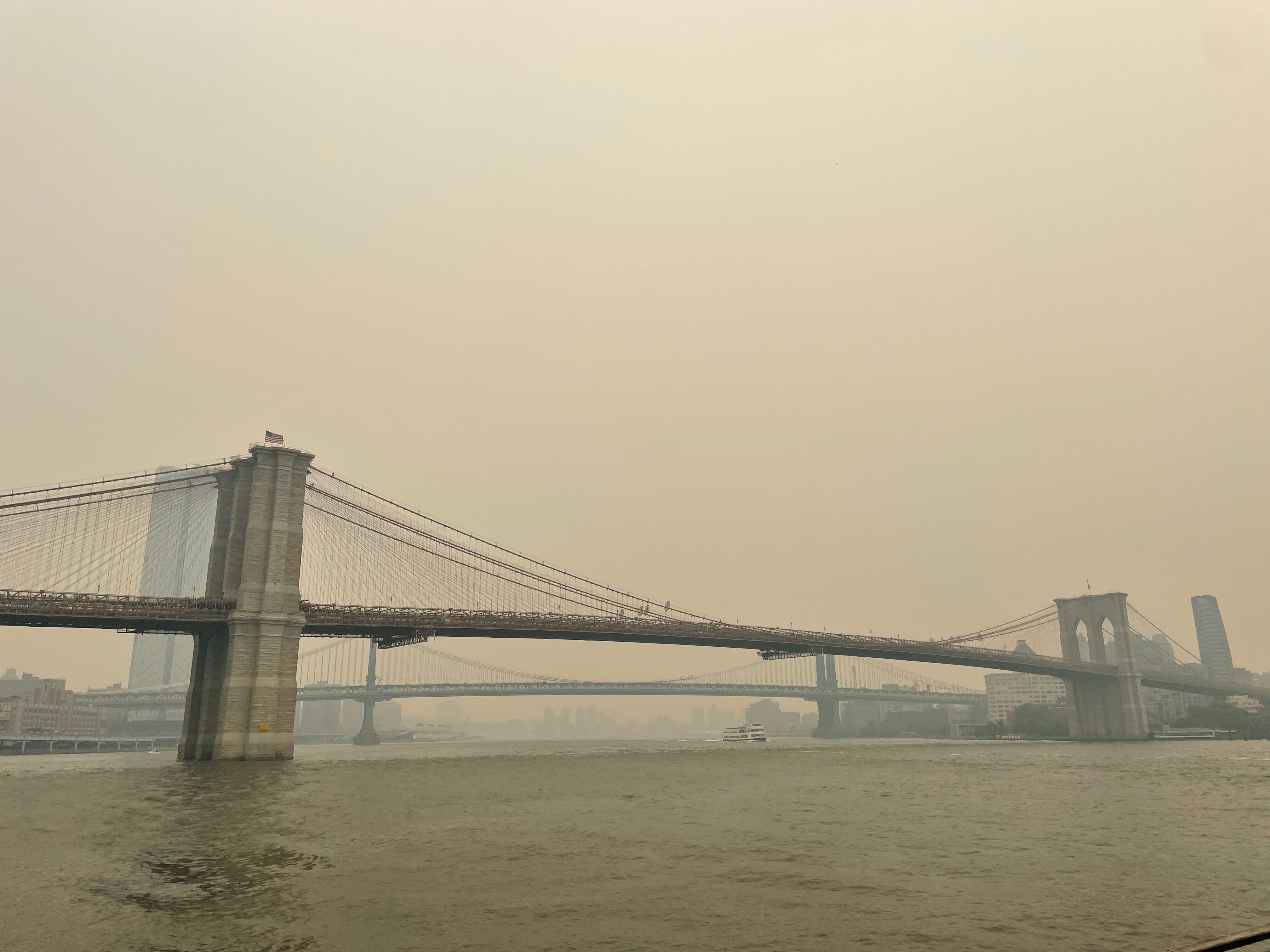 The Brooklyn Bridge, in a backdrop of haze.
