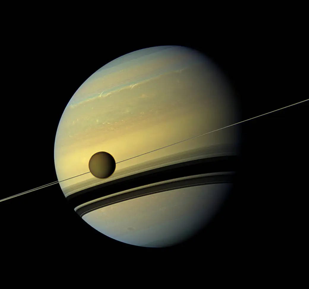 Saturn and its largest moon, Titus.