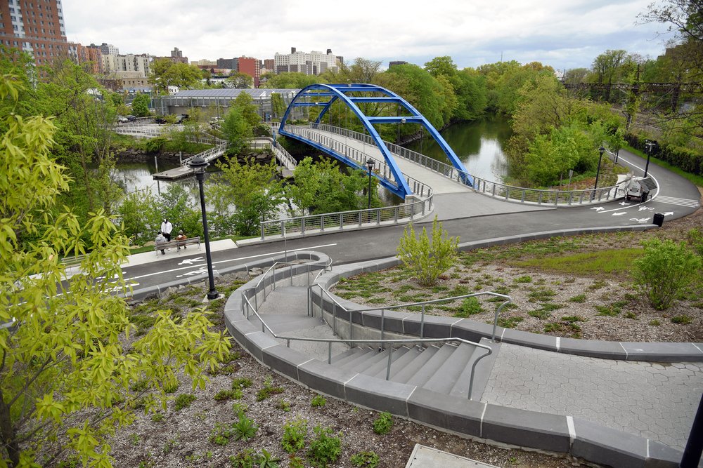 The newest sections of Starlight Park connect the east side of the Bronx River to the ballfields and playgrounds on its western shore.