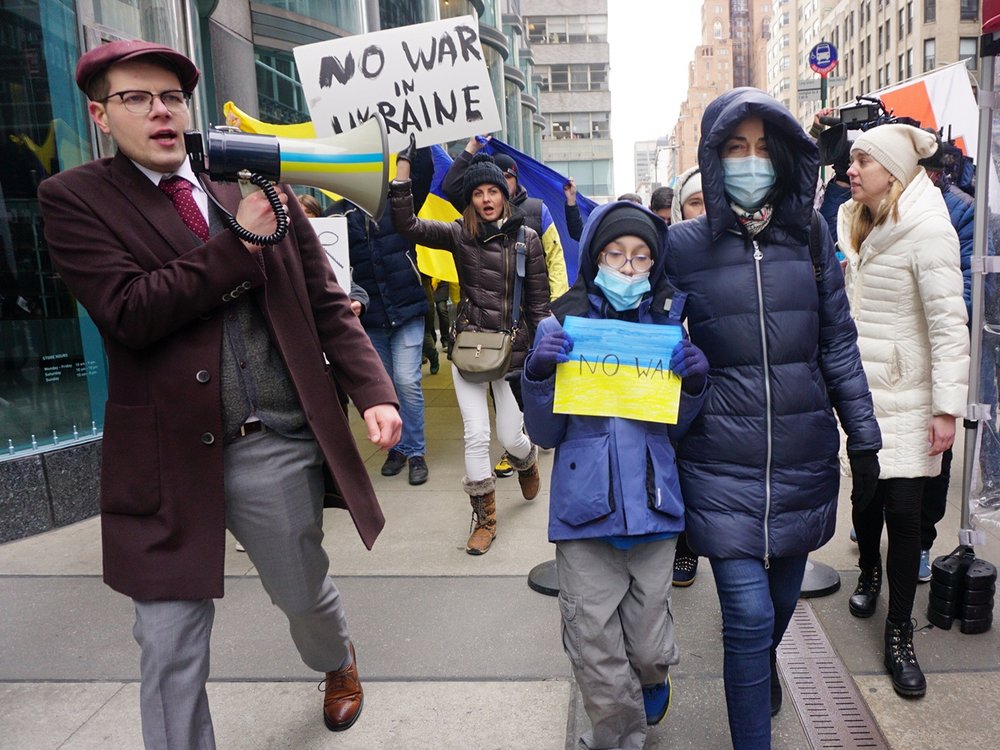 Protestors march outside of the Consulate General of the Russian Federation on East 91st Street on Thursday.