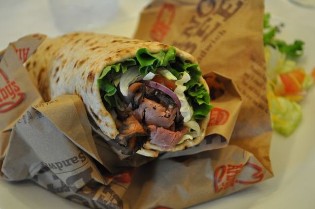 Christopher Robbins/GothamistUltimate Angus WrapFor those GQ types who enjoy wolfing down rare red meat in between sessions with a personal trainer and leafing through a Brookstone catalogue, Arby's still-on-the-drawing-board Ultimate Angus Wrap has you covered. It contains a few green vegetables and a "side salad," that is, if you opt to sub out the curly fries.