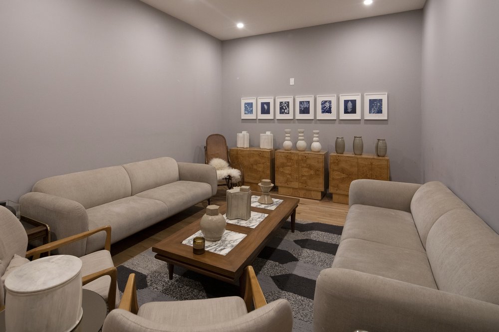 Couches and art in a large room.