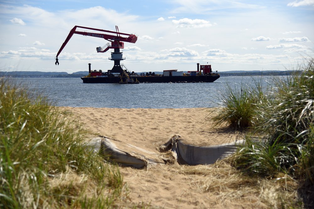 A crane placing stones for the Living Breakwaters, off the coast of Tottenville in Staten Island. Photo taken September 29, 2022