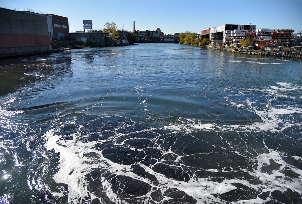 The waters of the Newtown Creek have been polluted by more than a century of industrial waste, including heavy metals, pesticides and carcinogenic chemicals.