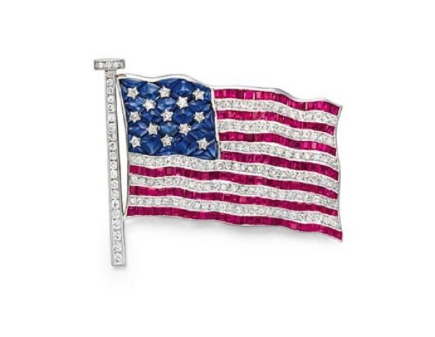 041812_jewels6.jpg A diamond, sapphire, and ruby American flag brooch, by Cartier. Estimate: $30,000 - $50,000; Sold: $80,500