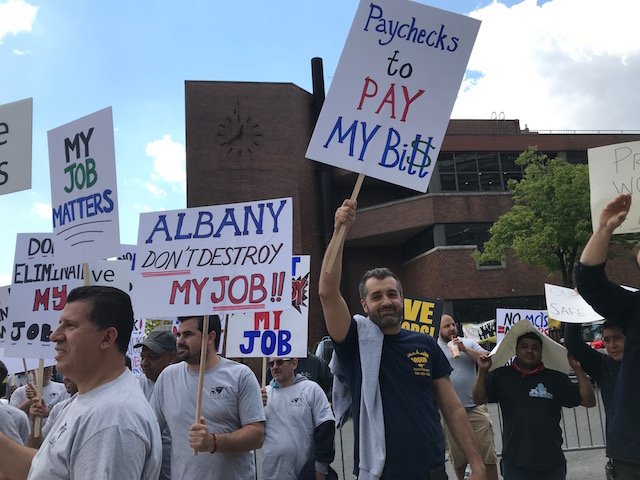 Contractors protest rent reform on May 17th, 2019 at Medgar Evers College in Brooklyn.