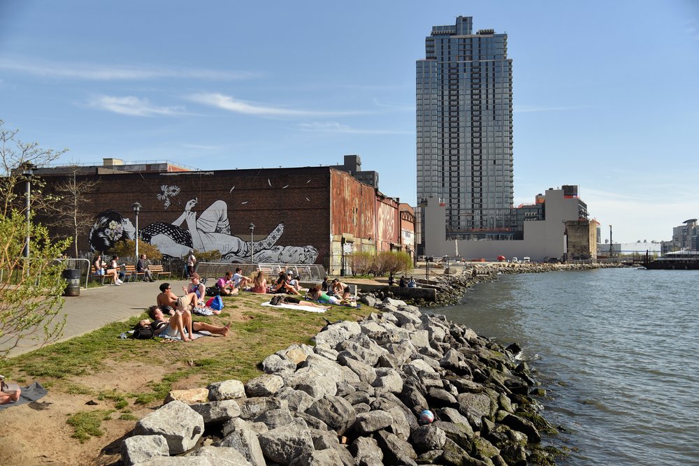 A spring day at WNYC Transmitter Park. South of the park, a stretch of waterfront in front of the Greenpoint Terminal Warehouse remains closed to the public.