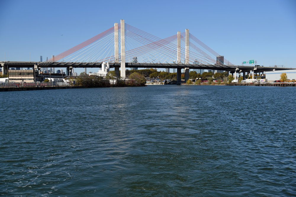 The Newtown Creek and its tributaries are lined by active freight train tracks, and crossed by busy bridges and highways, including the Brooklyn-Queens Expressway and Queens–Midtown Expressway.