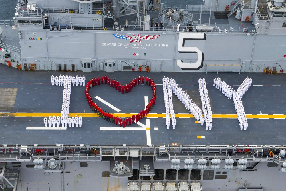 Sailors onboard the multipurpose amphibious assault ship USS Bataan (LHD 5) pose for a "I heart New York" photograph in preparation for Fleet Week New York in 2016. (U.S. Navy photo by Mass Communication Specialist 3rd Class Raymond Minami/)