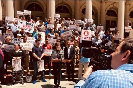 Diane Ramirez of Halsteadā© real estate speaks at a protest outside City Hall against a proposed cap on brokers' fees.