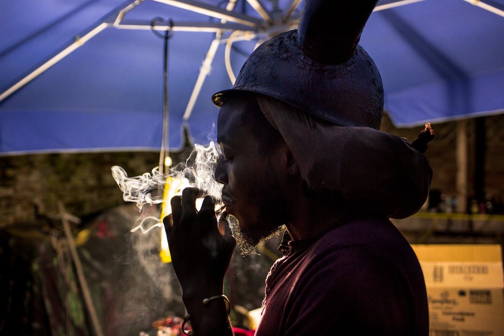 06d92ac45jabjab-jpg.jpeg Duran Griffith, 31, wears his personal horned helmet in his backyard in Brownsville. Griffith is one of the leaders of Greenhouse Jab Jab, a Grenadian collective that encourages J'Ouvert attendees to dress in horns, paint, and oil as a means of reconnecting with their heritage.