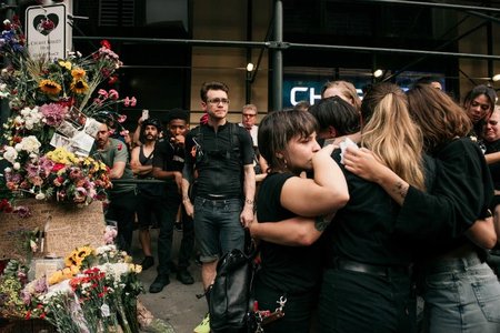 Mourners gather at the spot where 20-year-old Robyn Hightman was killed by a truck driver last Monday.