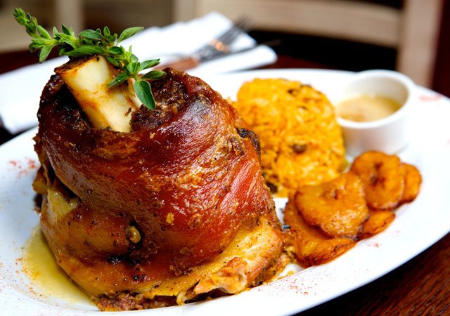 071609sazon3.jpg Pernil ($19), consisting of three pounds of roast pork legs with pigeon pea rice and sweet plantains.