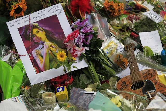 072611winehouse6.jpg The memorial site outside Amy Winehouse's apartment in London