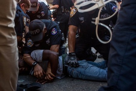 NYPD officers arrest a man at a protest against police brutality SCOTT HEINS / GOTHAMIST