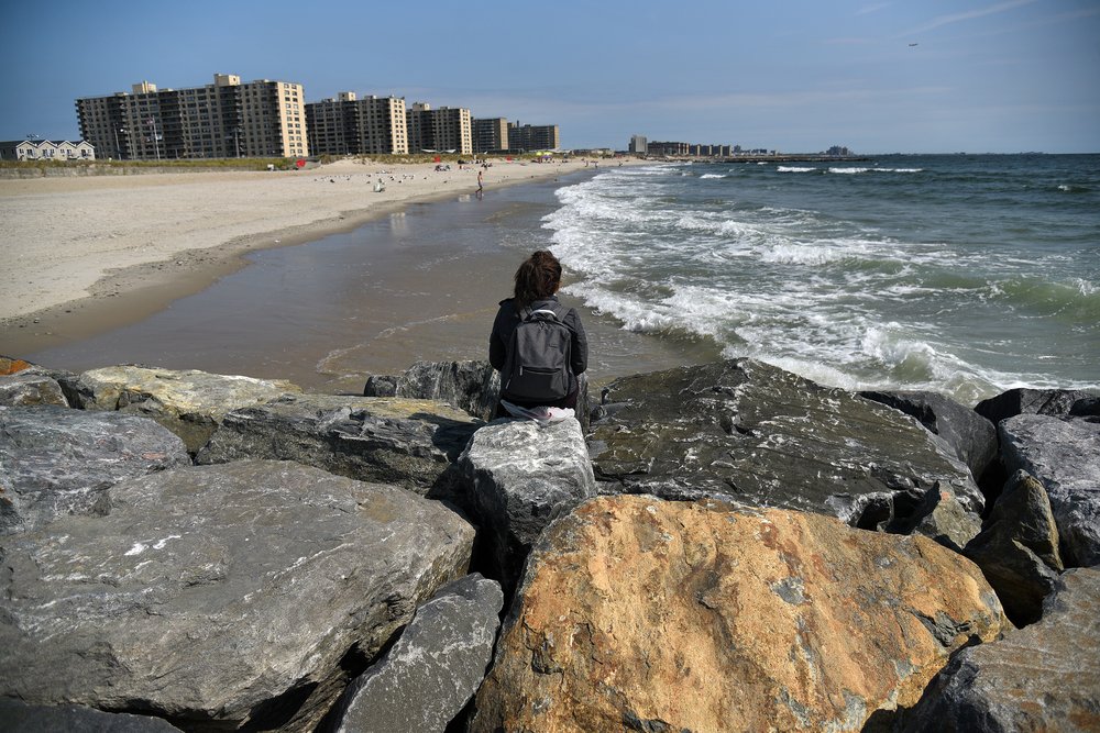A beachgoer visiting a newly completed jetty along the coast of the Rockaway Peninsula in Queens. Photo taken September 17, 2022