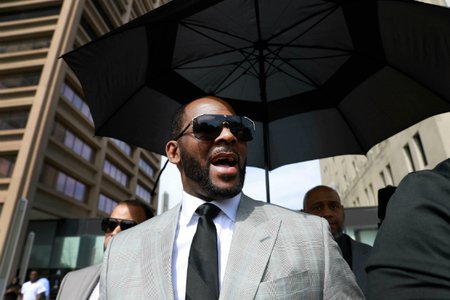 R. Kelly leaving a courthouse in Chicago after pleading not guilty to 11 sex-related charges last month