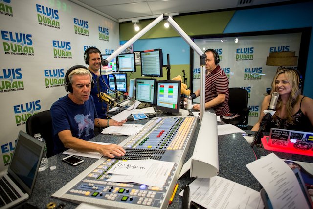 Elvis and his cohosts in the studio.
