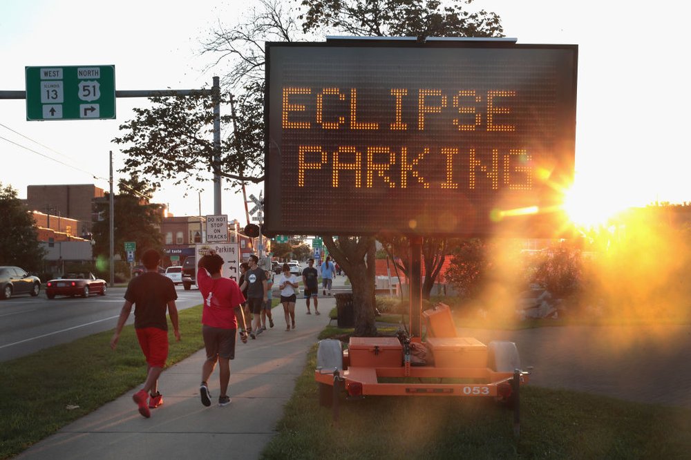 0872e0400gettyimages-835661432-jpg.jpeg A sign directs visitors to parking areas to view the solar eclipse on August 19, 2017 in Carbondale, Illinois. With approximately 2 minutes 40 seconds of totality the area in Southern Illinois will experience the longest duration of totality during the eclipse. <br>