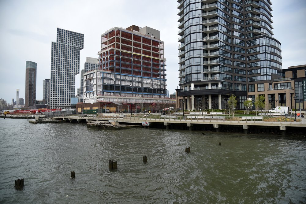 A row of new towers stretches up Greenpoint’s waterfront from India Street.