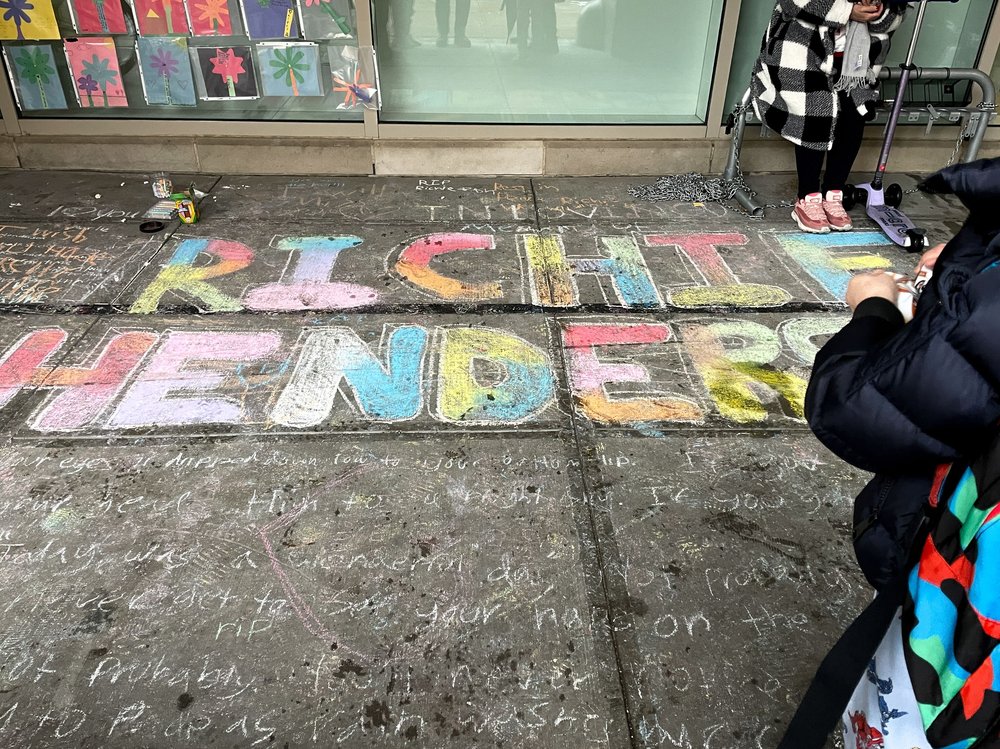 The name Richie Henderson written in chalk.