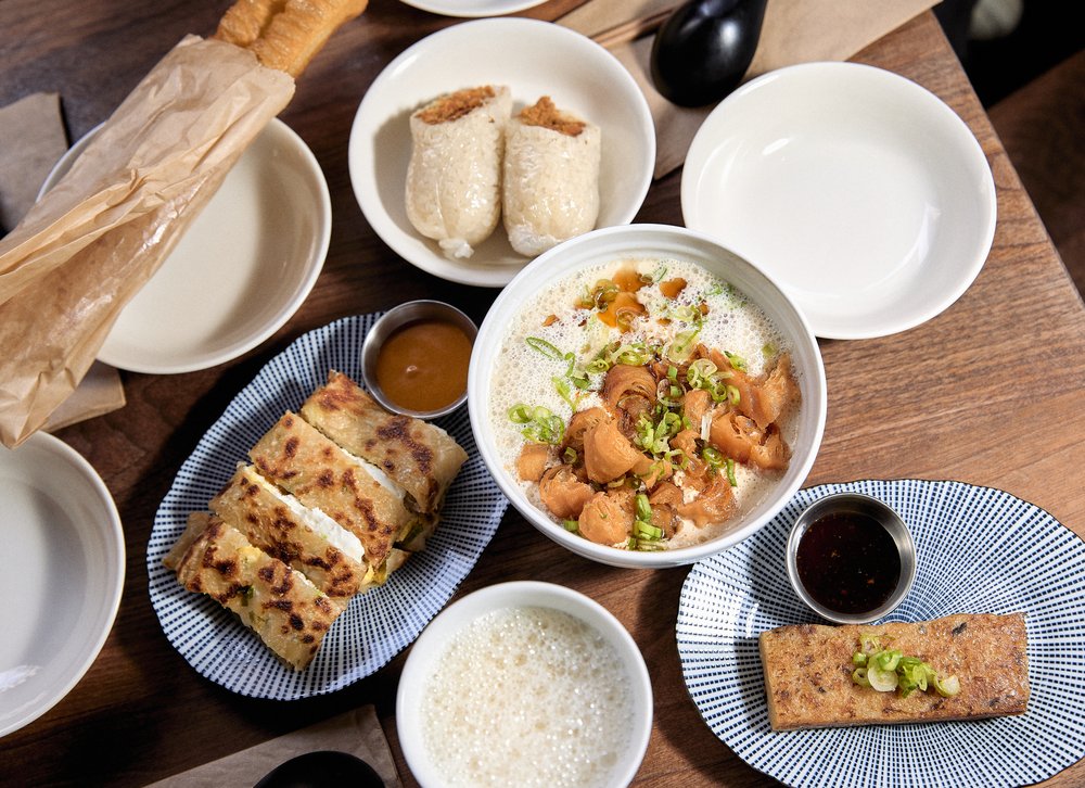 An array of dishes in white bowls.