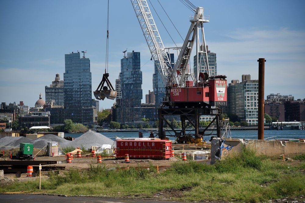 Piles of gravel loaded onshore for soil stabilization work in East River Park, Manhattan. Photo taken September 14, 2022