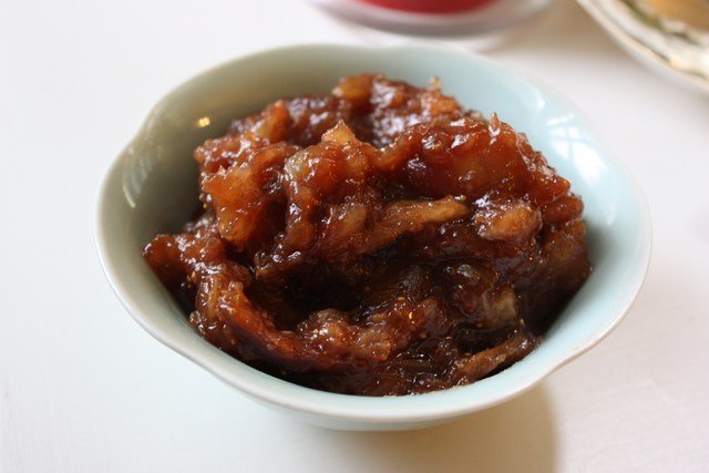 Bourbon Fig CompoteLet's get the bourbon fig compote started first because a) it will take the longest to prepare b) you can basically ignore it once everything goes into the pot and c) you can start drinking sooner. Hooray! Boozy, sweet, sticky—there are many things to like about this hearty compote but the best part is drinking while you make it it's super easy to make. If you can't find fresh figs in your market, sub in rehydrated apricots, prunes or other dried stone fruits, which should be readily available, especially in the winter. This recipe was created for biscuit topping but it's by no means limited to slathering on your baked goods; serve some alongside roasted chicken or pork or spoon a dollop on some vanilla ice cream or yogurt. Ingredients     Woodford FTW (Nell Casey/Gothamist) 8 ounces fresh figs, quartered and with stems removed1/2 cup dark brown sugar1/3 cup bourbon (you can sub rye but don't go throwing Johnnie Walker in there)1/3 cup water2 tablespoons lemon juice1/4 teaspoon black peppercorns1/4 teaspoon whole cloves1 fingertip-sized knob of fresh ginger (more if you can take the heat)pinch kosher saltYou'll want to create a (FANCY COOKING WORD ALERT) sachet to house the whole spices because it's a maddening task to find all those little buggers once the jam has congealed and it's also not sexy to bite down on a whole peppercorn and break your tooth. Luckily, sachet is just a fancy word for "tiny little cheesecloth bag," so calm down. Cut a square of cheese cloth, place the peppercorns, clove and ginger inside, then tie with a string. Congratulations! You are one step closer to a James Beard Award.Next: dump everything into a small saucepan over medium-low heat, stir it around a bit, then ignore for the next 20 minutes. Well, not really. Since we're working with sugar—and sugar loves to burn you when you're not paying it enough attention—you'll want to check in from time-to-time to make sure the liquid hasn't evaporated too much (if so, add a bit of water) and that the sugar is gently caramelizing as opposed to scorching your pot.     Sexxxy sugar booze fig party (Nell Casey/Gothamist) Once the figs have softened nicely you should be able to macerate easily with a potato masher or a fork. By then, most of the liquid should have evaporated, leaving a nice, sweet glaze over all of the fig bits. Remove your bundle-o-spices and discard. Compote can be served hot, room temp or chilled and will keep for a few days in a tightly-sealed tupperware if you want to make it in advance.