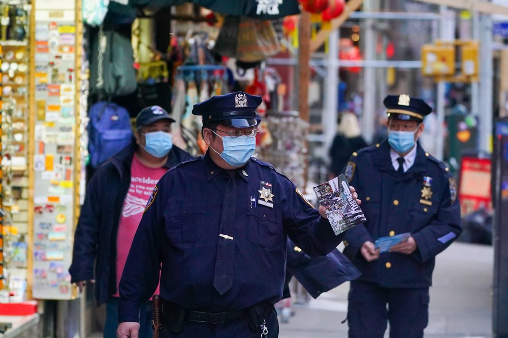 NYPD officers patrol Chinatown following the deadly spa killing of 8 people mostly of asian descent in Atlanta, Georgia.