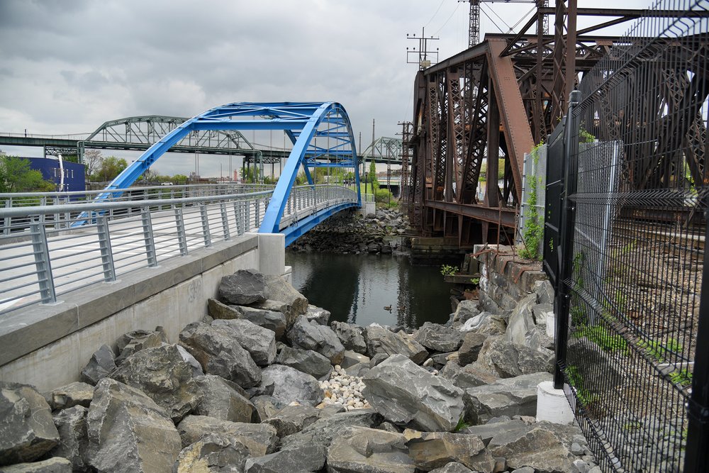 A new pedestrian bridge connecting to the southern end of Starlight Park has been built next to an older Amtrak bridge, along their Northeast Corridor train line.