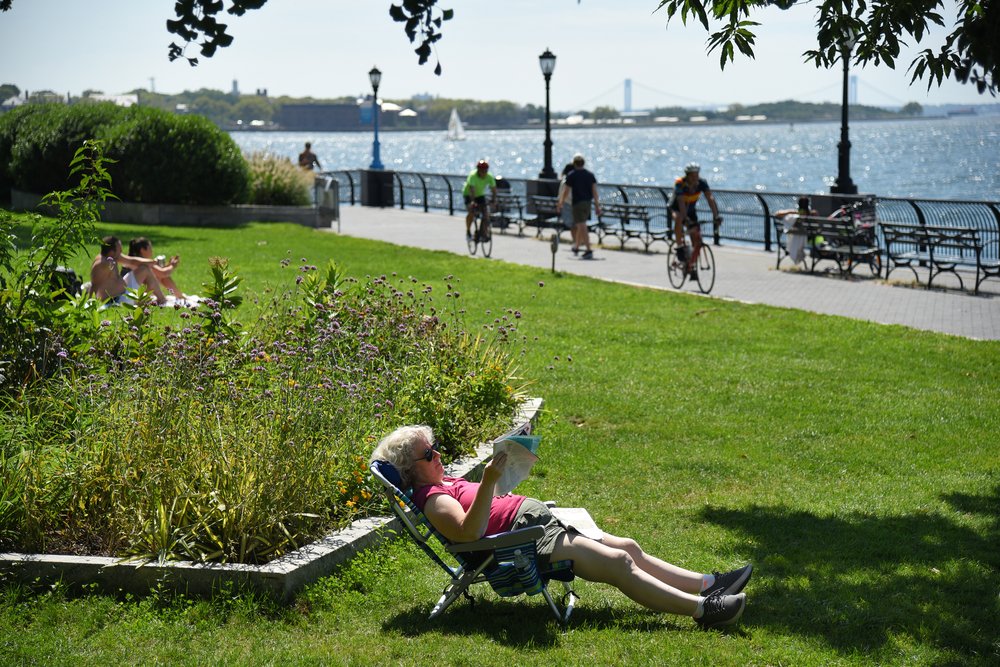 Visitors enjoying a fall day at Wagner Park in Manhattan, which is scheduled to be demolished in the coming weeks. Photo taken September 10, 2022