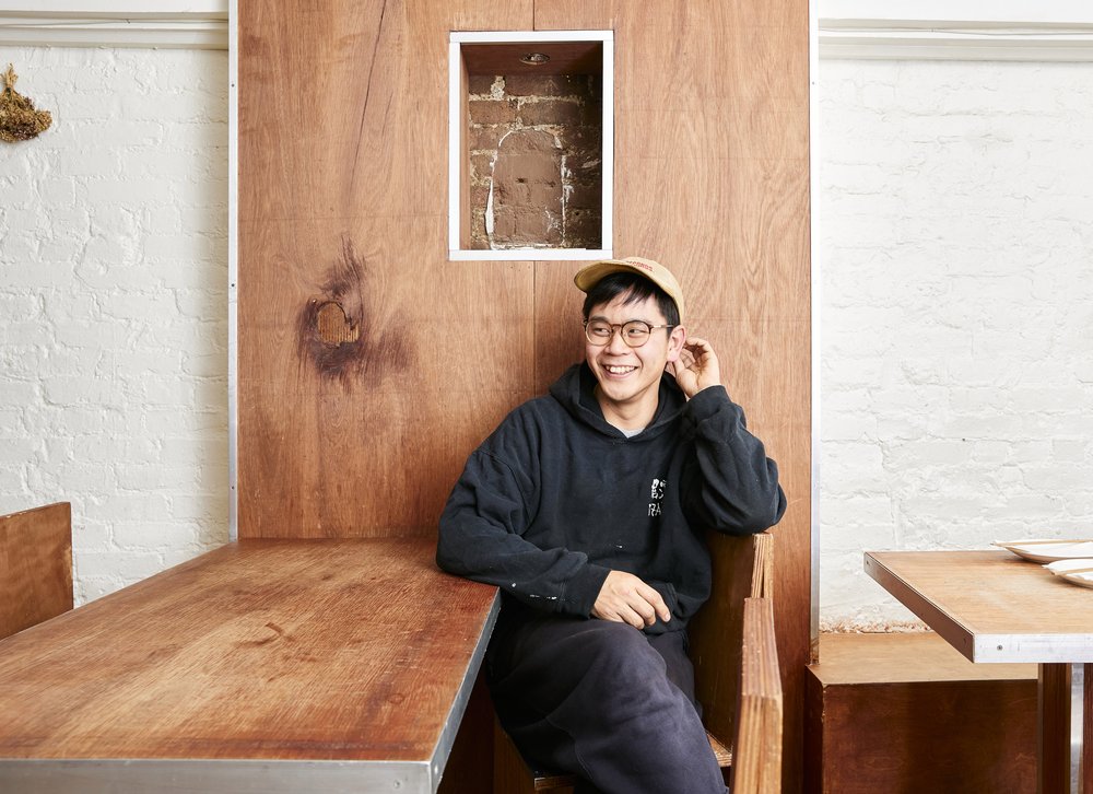 A man sits in a restaurant.