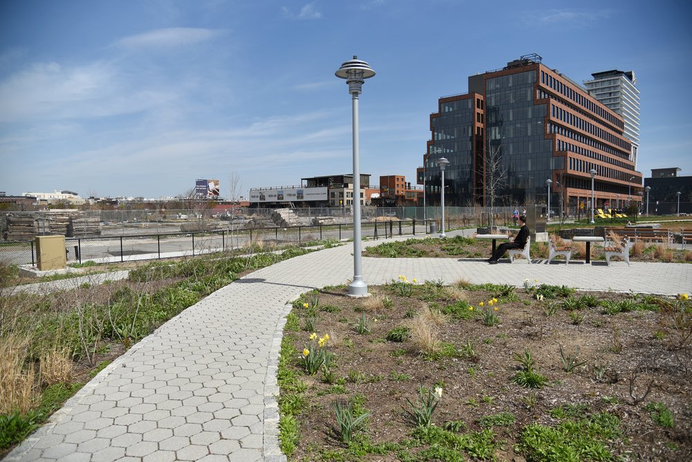 The park space at 50 Kent Avenue looks out onto the former site of the Bayside Fuel Oil Depot, whose oil storage tanks were demolished in 2019. The depot site has not yet been remediated.