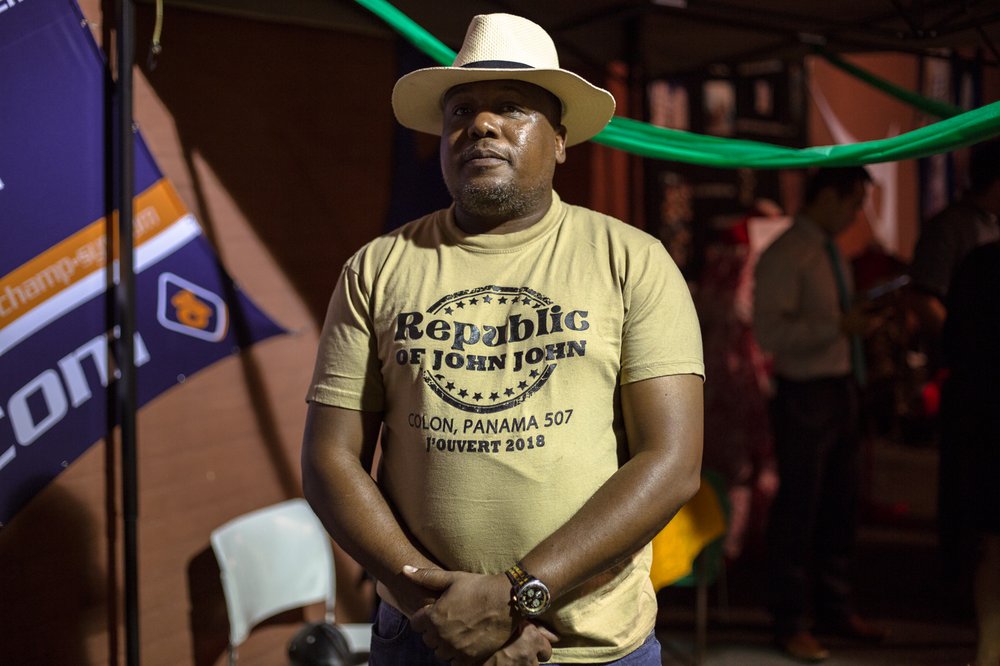 Kendall Julien of Republic of John John Mas stands wearing a Panama hat, in keeping with his band's 2018 theme.