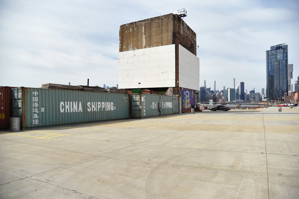 Today, the footprint of the burned buildings has yet to be redeveloped and opened to the public. Instead, it is home to the Skyline Drive In movie theater and NYC Glamping, where visitors can camp on the waterfront, inside a shipping container.