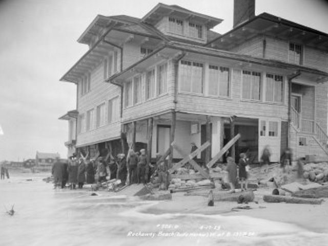 150512oldrock.jpeg "Rockaway Beach (Belle Harbor), west at Beach 137th Street. Storm damage, basement and first floor level of house jacked up by temporary supports and sandbags, people. April 17, 1929."