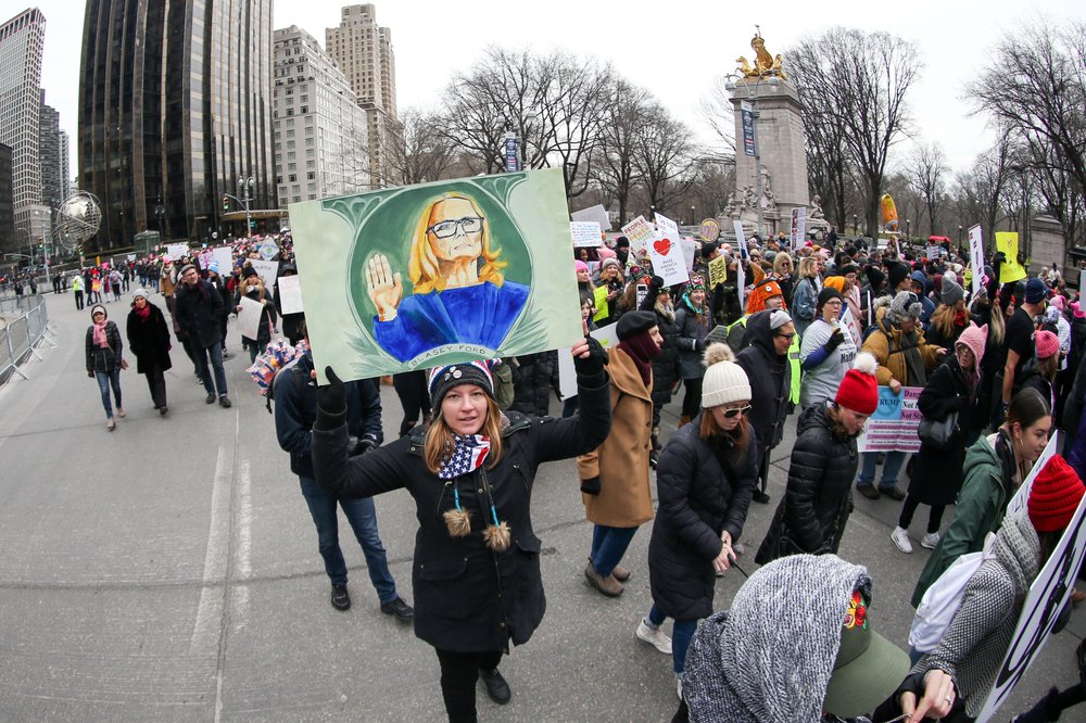 People participating in the NYC Women's March (William Volcov/Shutterstock)