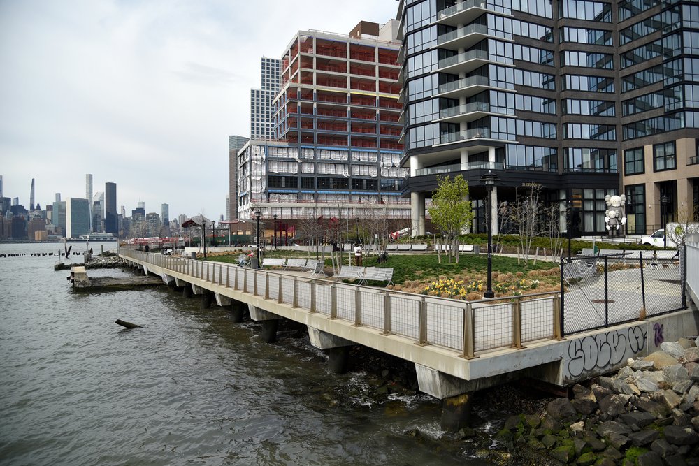 Today the same site is home to a public esplanade and playground built as part of The Greenpoint, a 40-story apartment tower erected after a brownfield remediation project removed the site’s hazardous waste and oil tanks.