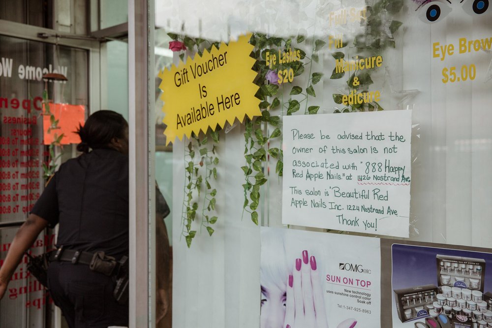 170baefa420180807gothamist_nailsalonprotest-17-jpg.jpeg An officer goes into the salon.<br>