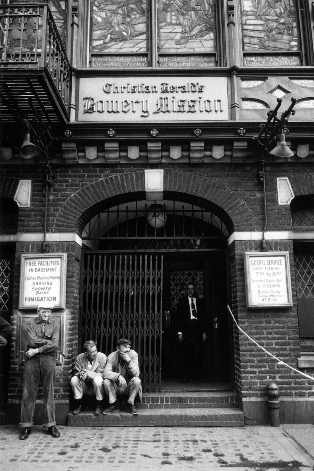 1e278e916.jpeg "Homeless elderly men outside the Christian Herald's Bowery Mission. January 1961."