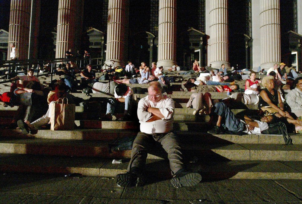 Commuters sleep on steps of the Farley post office (MIKE APPLETON/AP/Shutterstock)